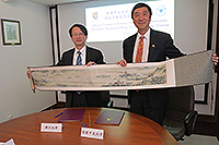Prof. Wu Zhaohui (left), President of Zhejiang University, presents a souvenir to Prof. Joseph Sung, Vice-Chancellor of CUHK